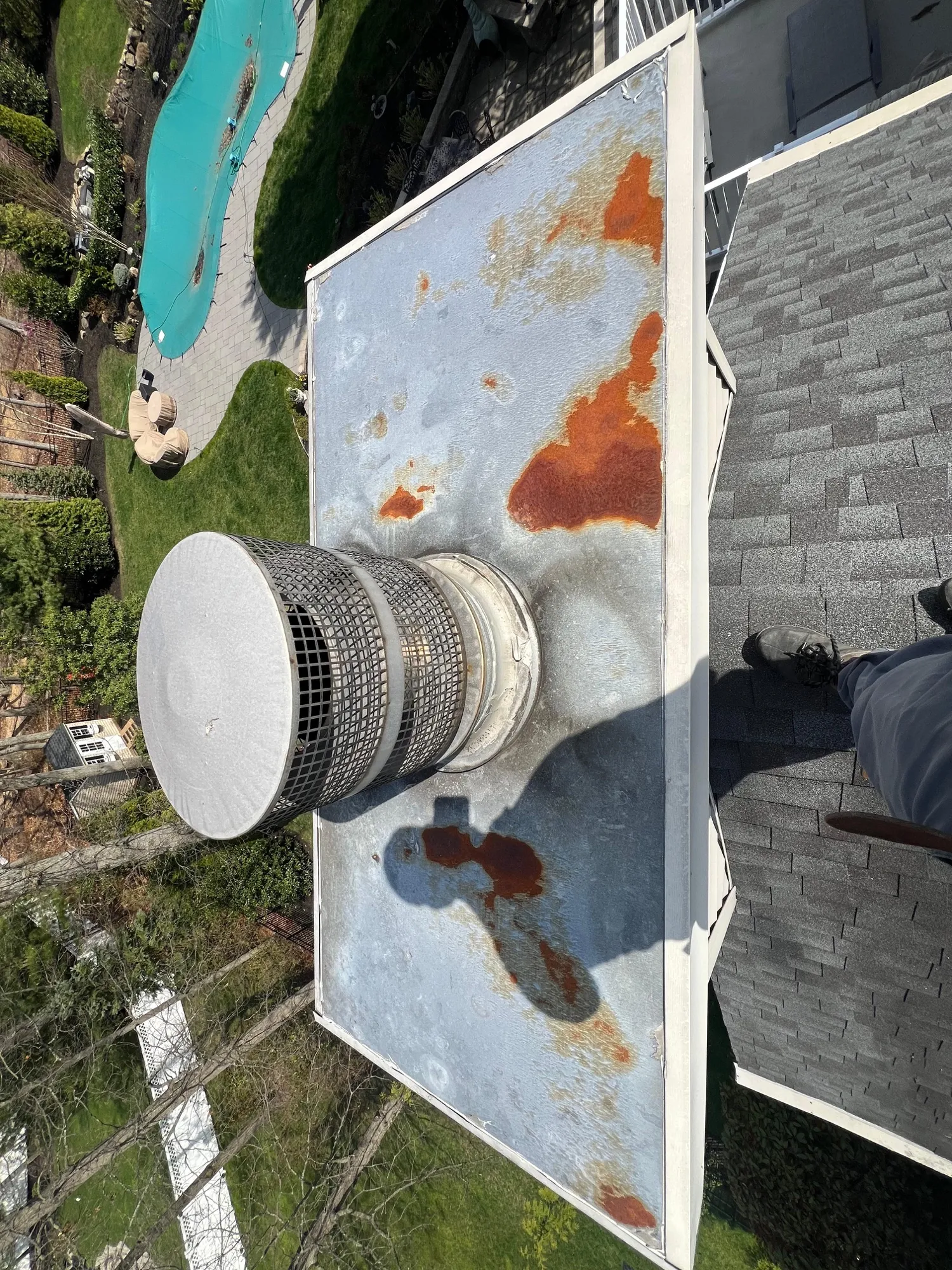 Newly built brick chimney on a residential roof