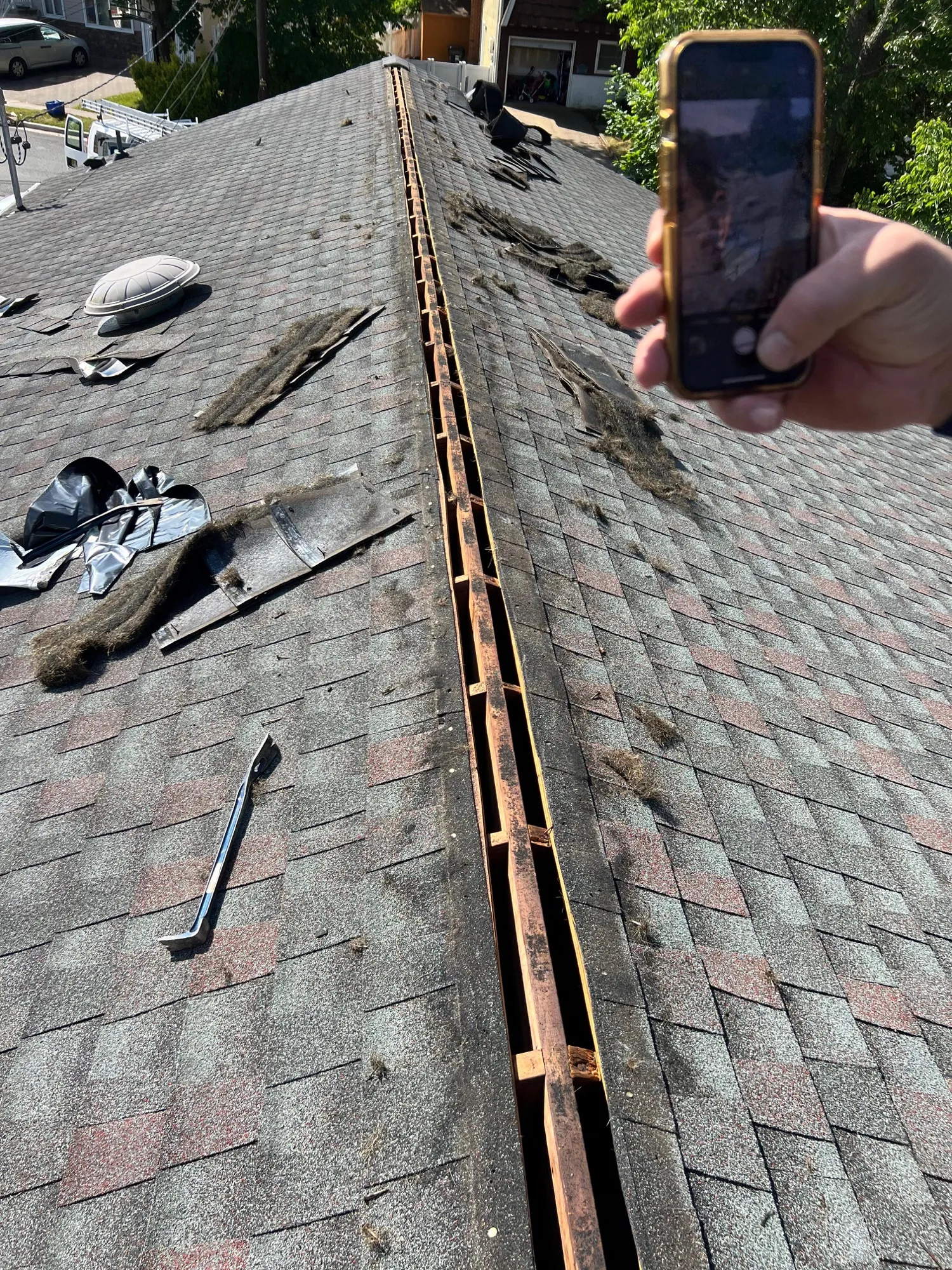 Seamless aluminum gutter installation in progress