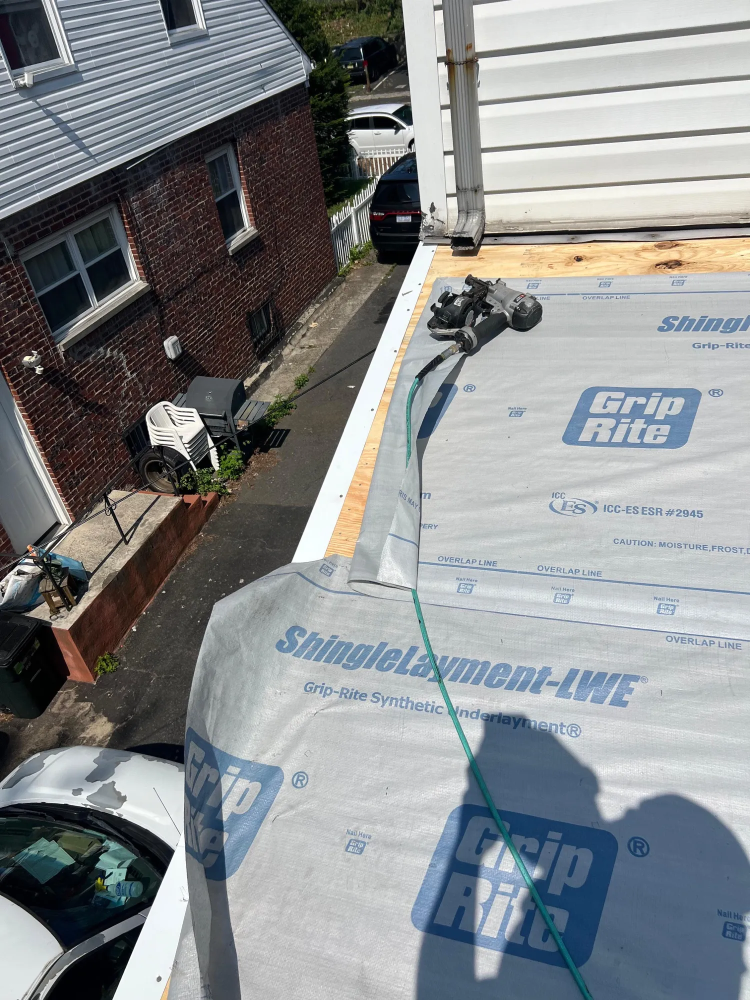 Major roof reconstruction project in progress after storm damage