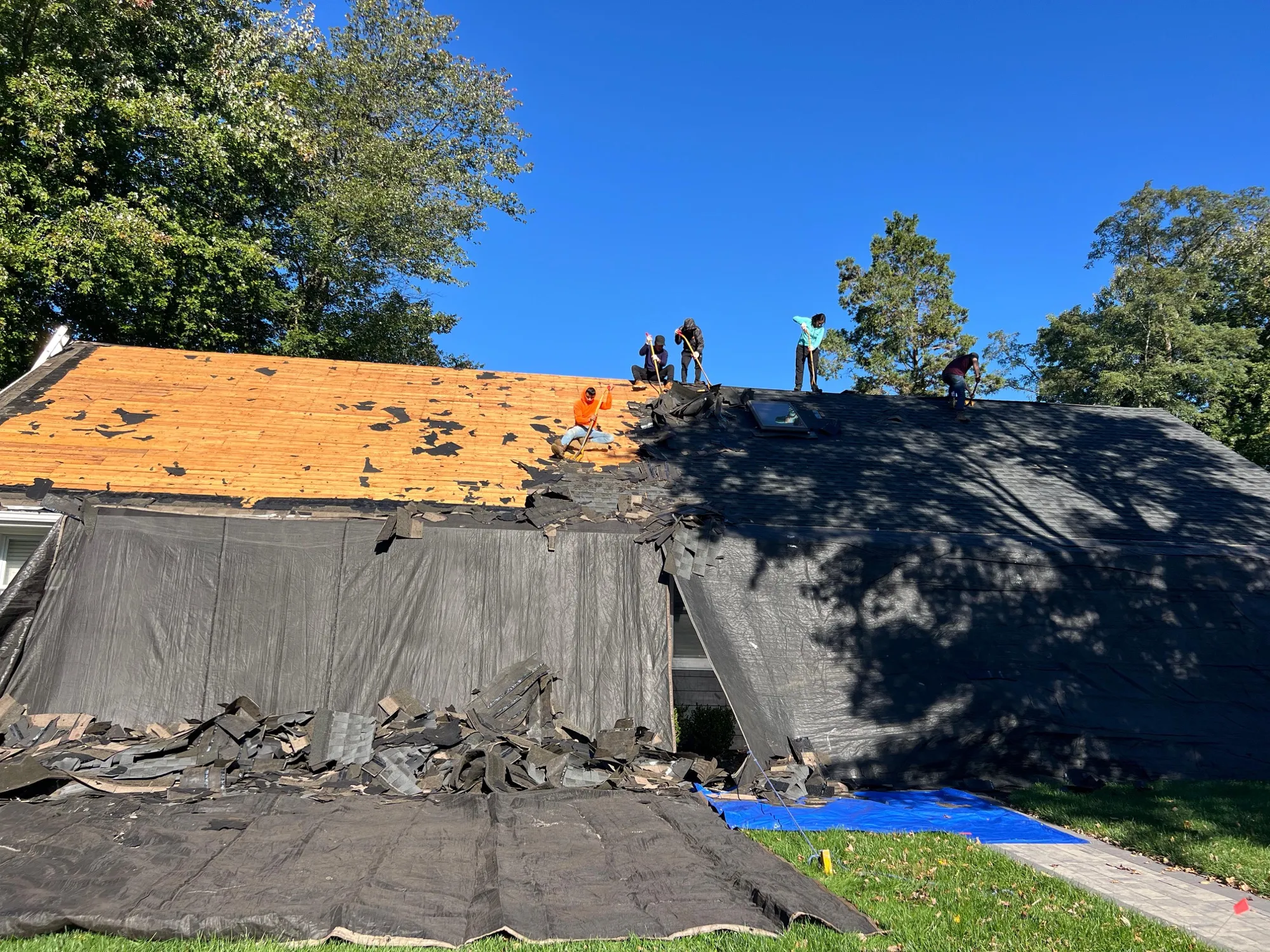 Two-story New Jersey home with a finished roof installed by Independent Homes Improvement