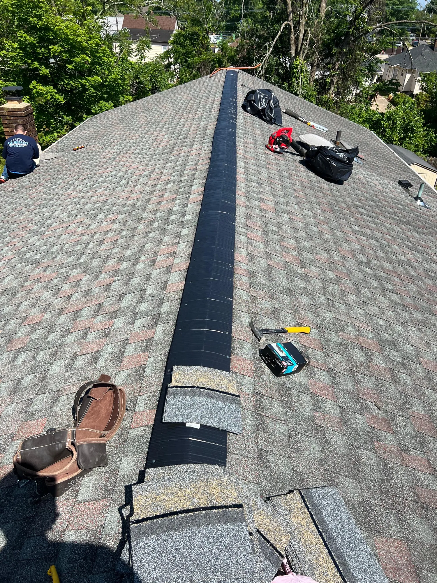 Roof being torn off down to the decking